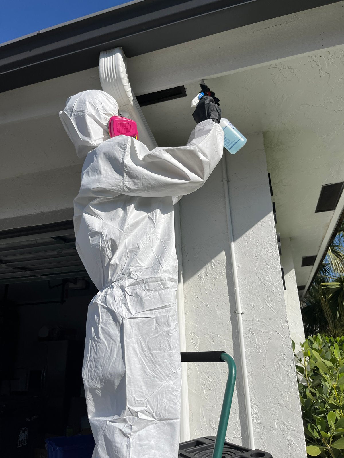 Environmental inspector sampling suspect asbestos material