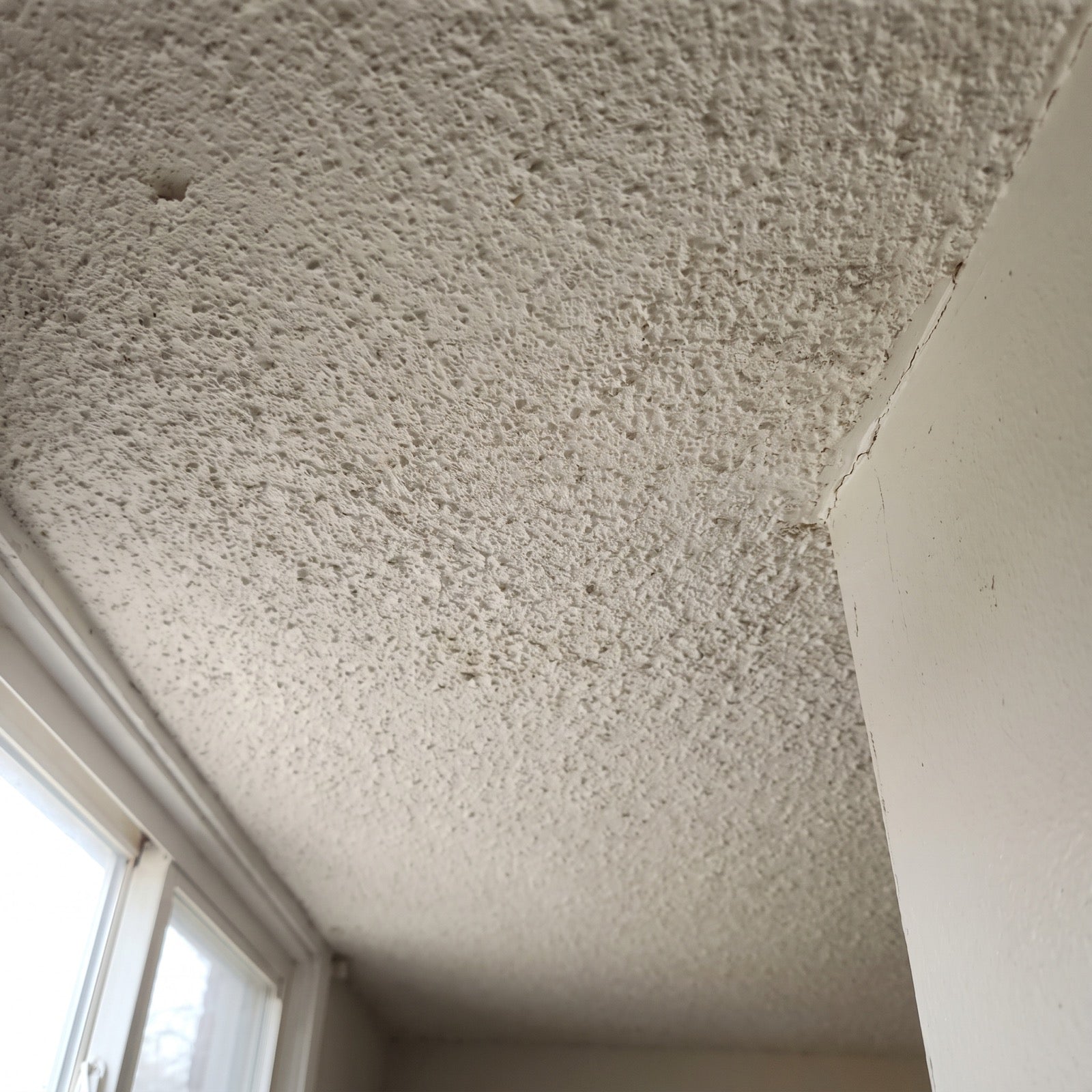 Textured popcorn ceiling in an older home — asbestos testing