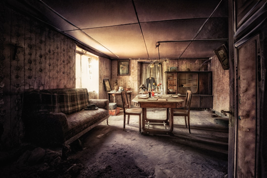 a living room with a couch, table and chairs
